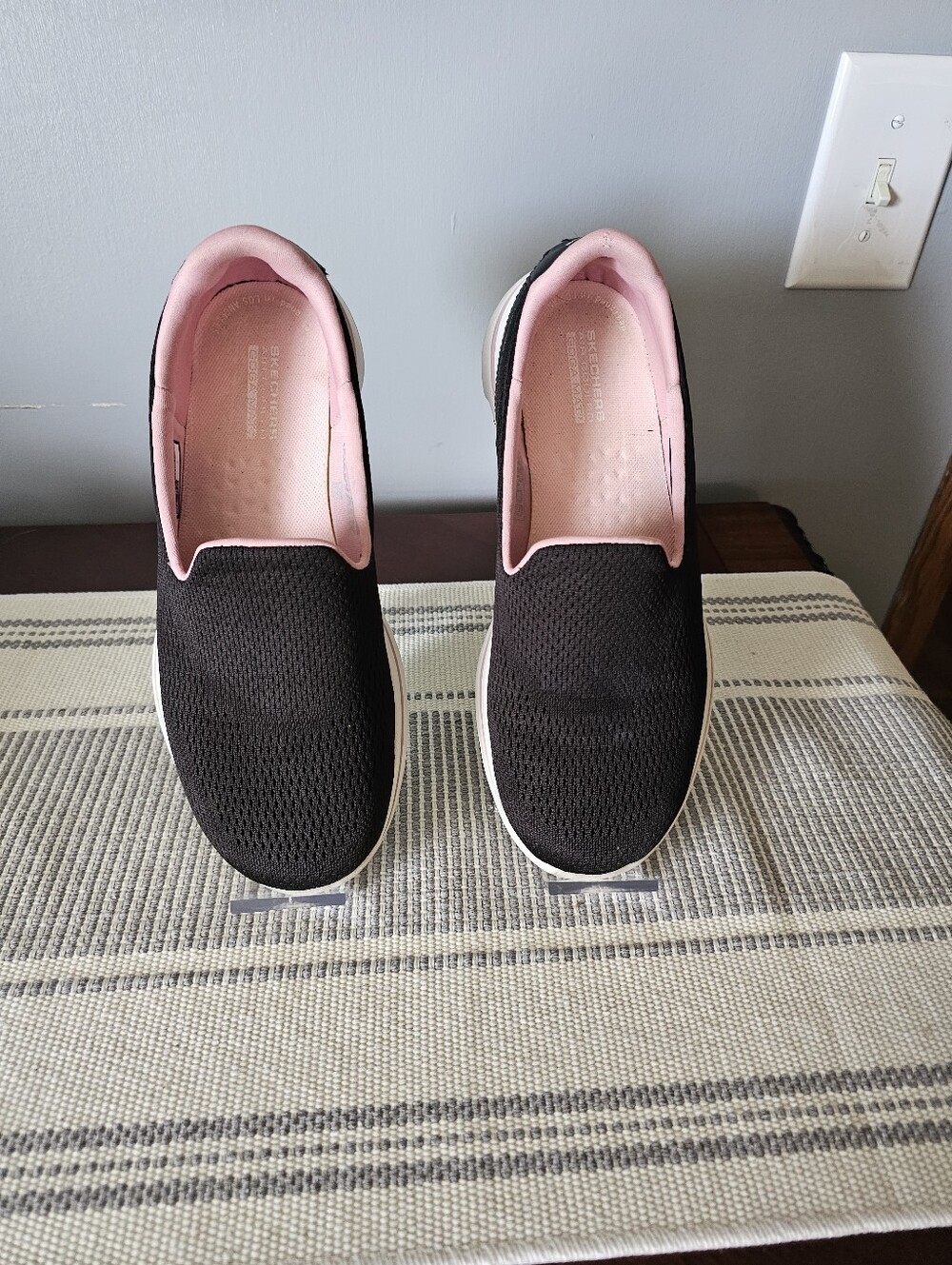 Skechers Women's Black Slip-On Sneakers with Pink Lining